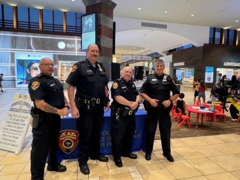 police officers recruiting in a mall