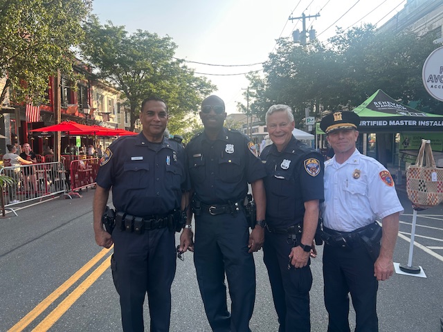 a group of police officers posing on a Main Street
